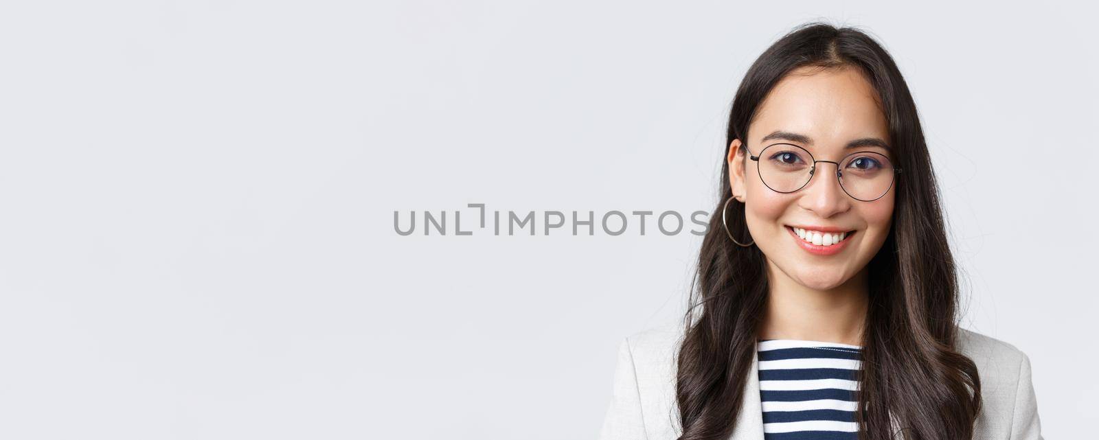 Business, finance and employment, female successful entrepreneurs concept. Close-up of smiling asian beautiful businesswoman wearing glasses and suit, looking confident and happy by Benzoix