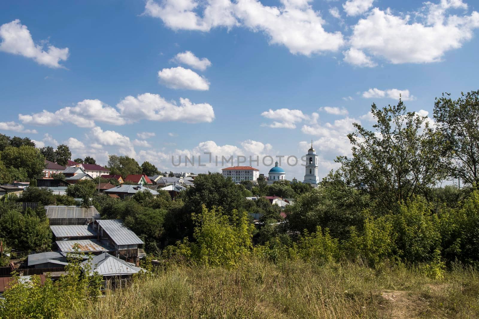 Serpukhov, Russia - June 18, 2021: Aerial view of the ancient Orthodox Christian monastery, located among the houses and nature in the city