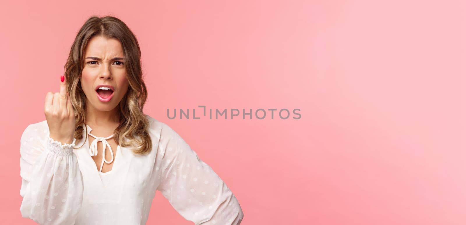 Close-up portrait of pissed-off bothered and fed up blond girlfriend arguing with boyfriend, showing him finger without ring as willing finally get married, standing upset pink background by Benzoix