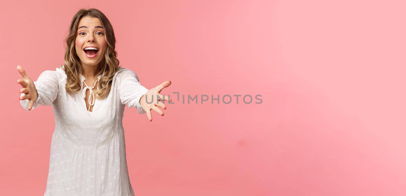 Come into my arms. Passionate cute blond girl in beautiful dress, reaching hands forward, catching something precious, attend wedding of friend, smiling excited, stretching arms, pink background by Benzoix