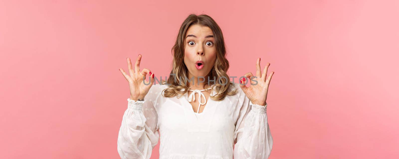 Close-up portrait of speechless and impressed, excited good-looking girl in white dress rate stunning performance being astonished with what she saw, fold lips, say wow and make okay signs by Benzoix