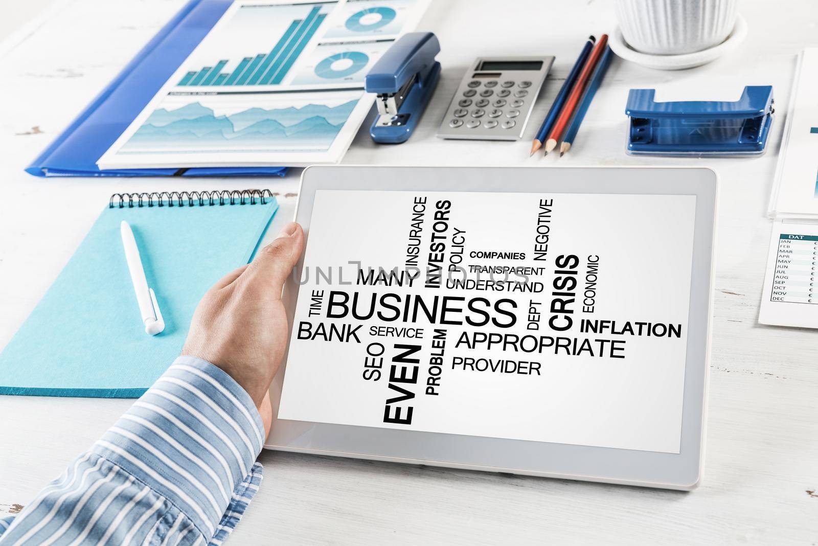 close-up, male hands with tablet. Businessman working at the table in office