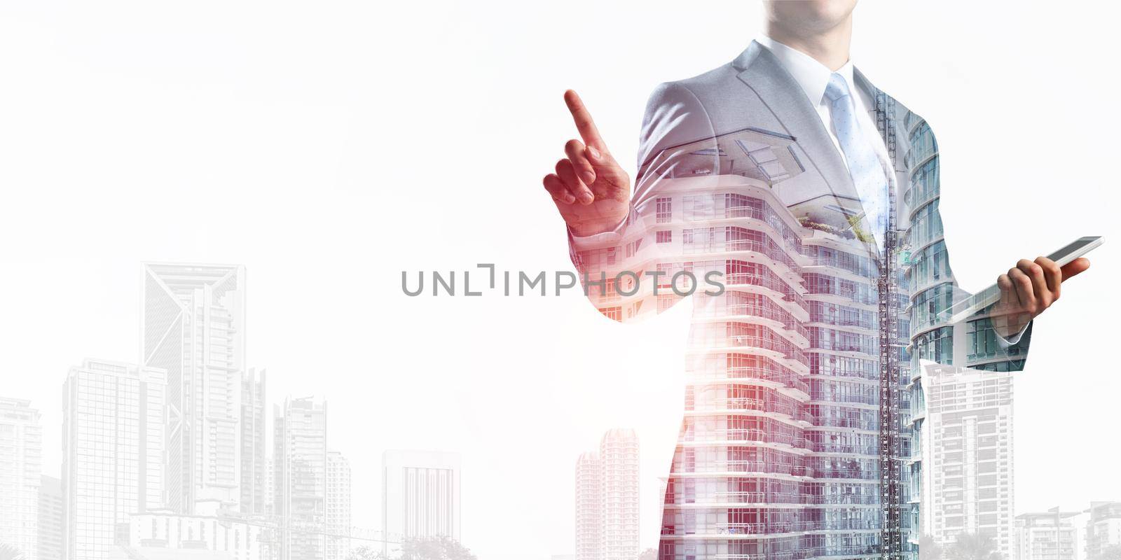 Double exposure businessman pointing on empty space and downtown cityscape. Standing consultant in business suit and tie without face. Blank copy space ready for business presentation