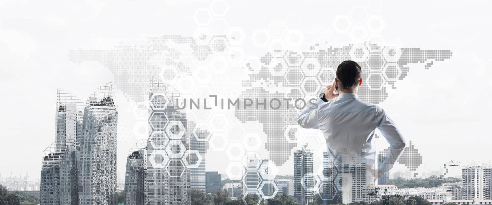 Double exposure of elegant businessman standing with back and talking his mobile phone