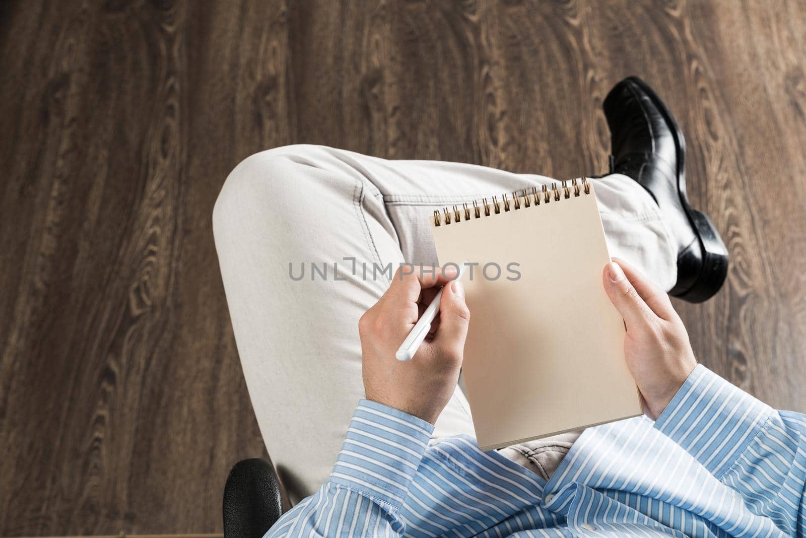 close-up of male hands with notepad, copy space