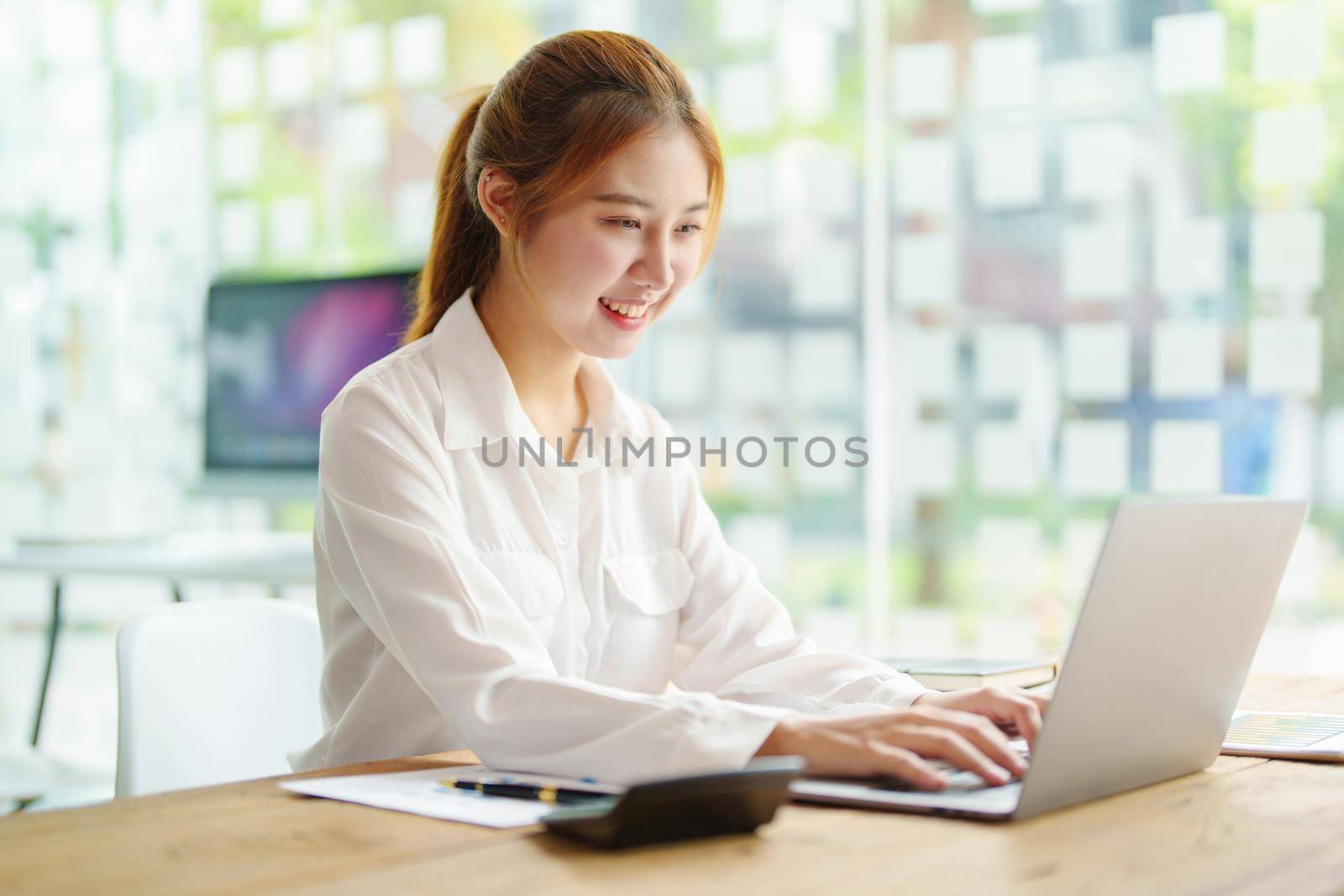 data analysis, plan, marketing, accounting, audit, Portrait of asian business woman planning marketing using computer and statistical data sheet to present marketing plan project at meeting. by Manastrong