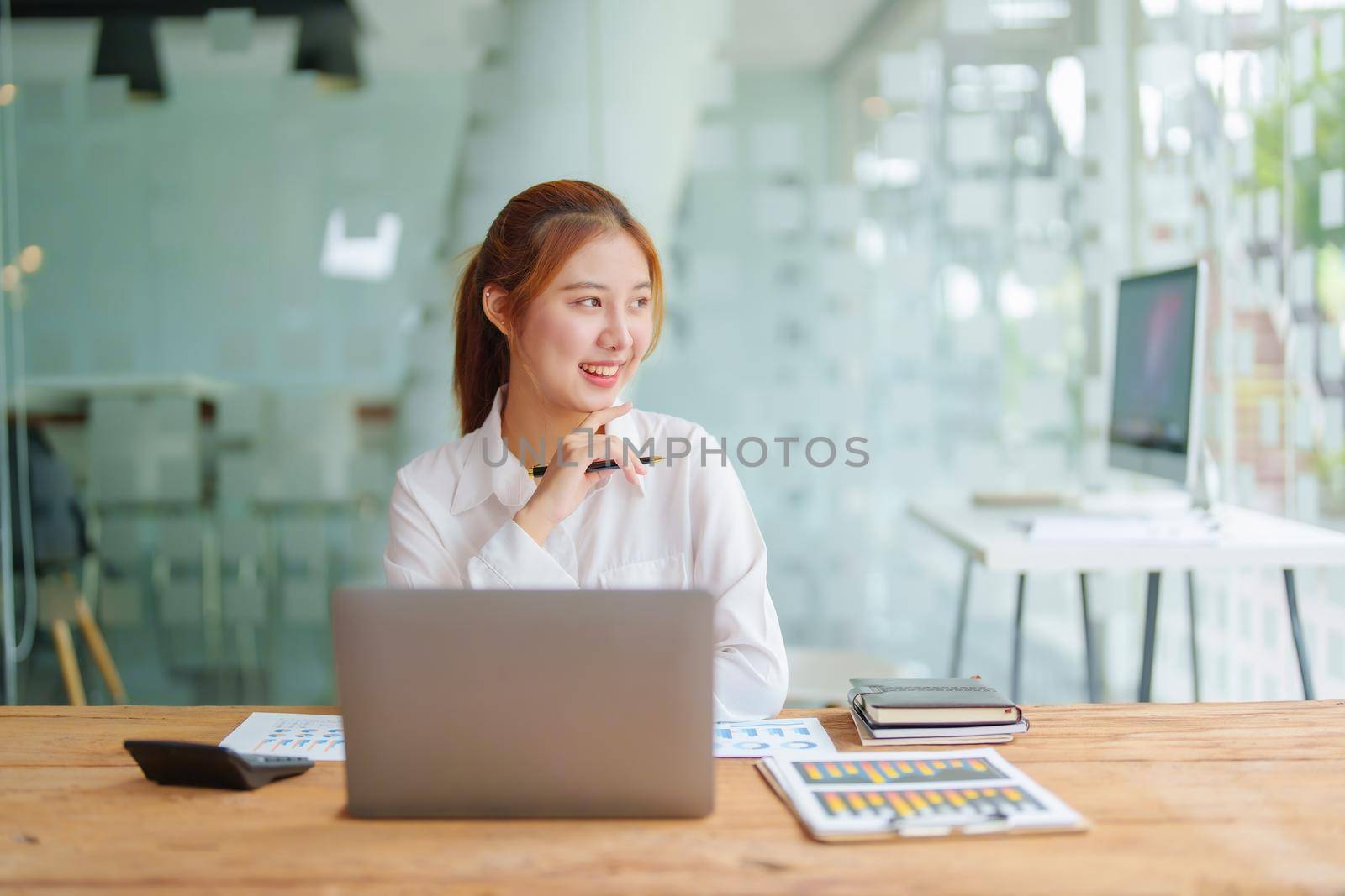 data analysis, plan, marketing, accounting, audit, Portrait of asian business woman planning marketing using statistical data sheet and computer to present marketing plan project at meeting. by Manastrong