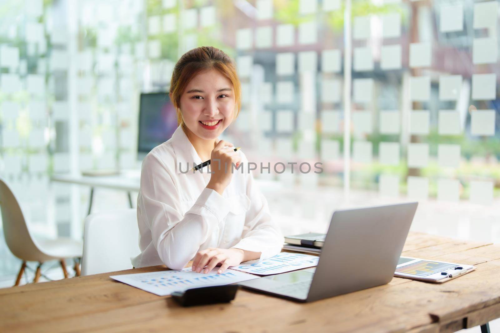 data analysis, plan, marketing, accounting, audit, Portrait of asian business woman planning marketing using statistical data sheet and computer to present marketing plan project at meeting. by Manastrong