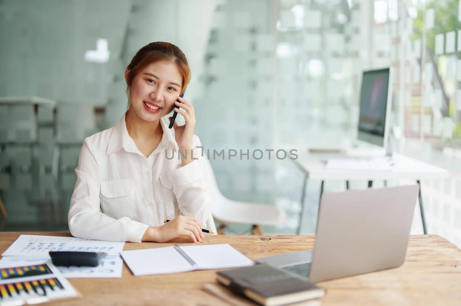 data analysis, plan, marketing, accounting, audit, asian business woman holding smart phone of planning marketing use statistical data sheet and computer to present marketing plan project at meeting