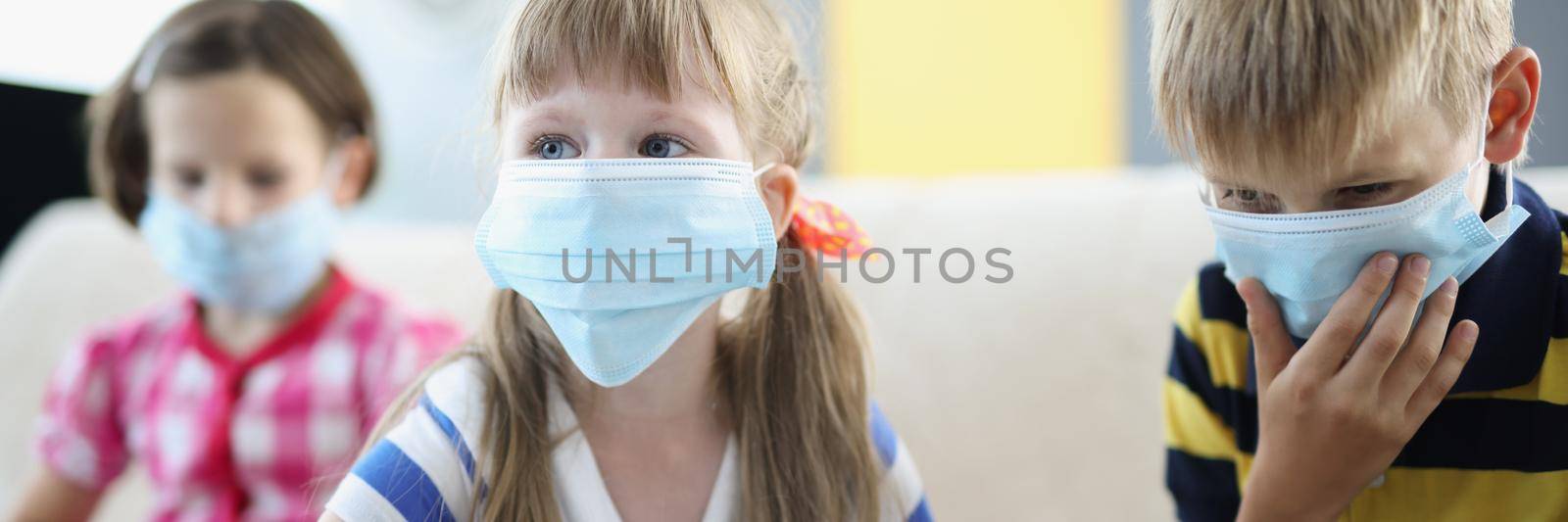 Portrait of children wearing face masks, infection in kindergarten, friends got sick, symptoms of virus. Boy coughing, closing mouth. Coronavirus spread, health, medication, quarantine concept