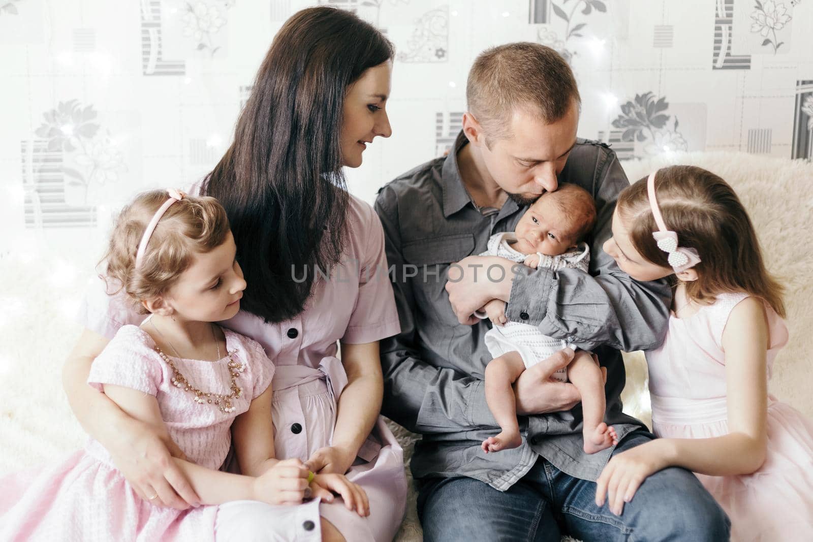 happy married couple with their three children. concept of family happiness.