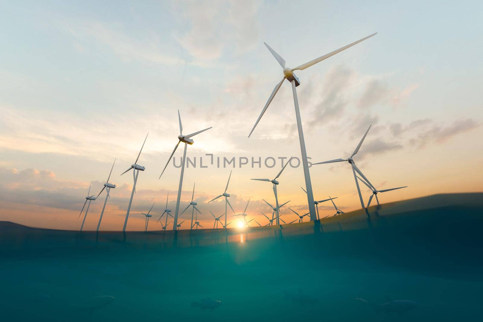 Wind power station and sea under sunset sky by asolano