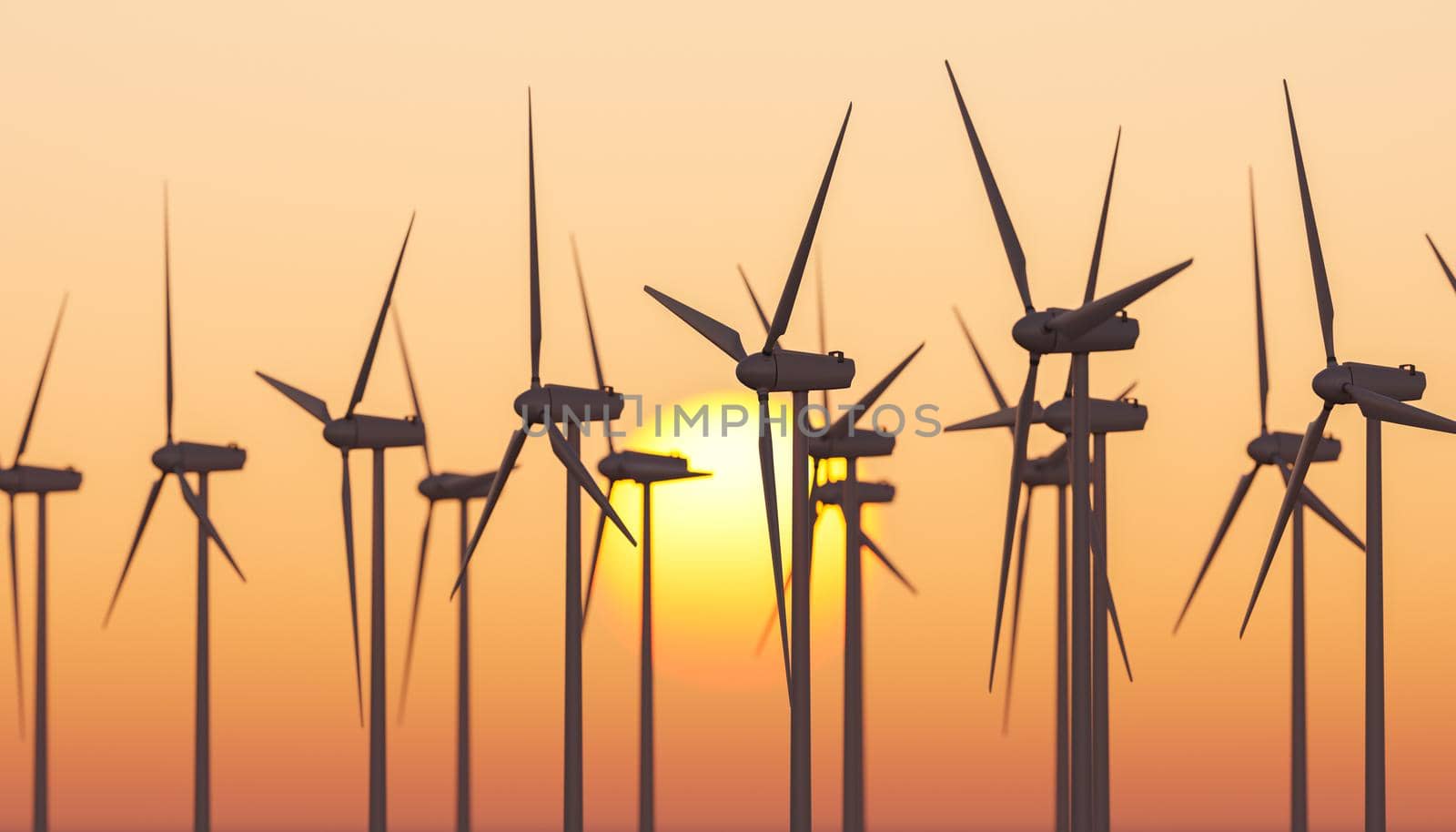 Windmills against sunset sky with sun by asolano