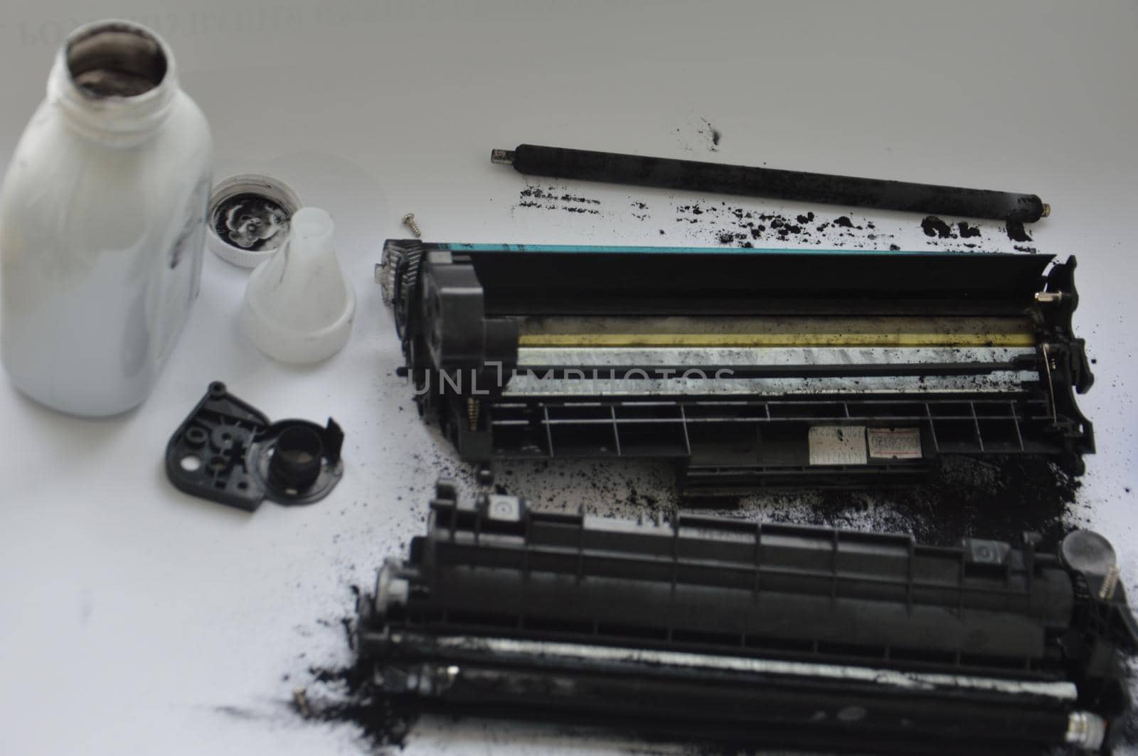 Charging the laser printer cartridge with toner the powder