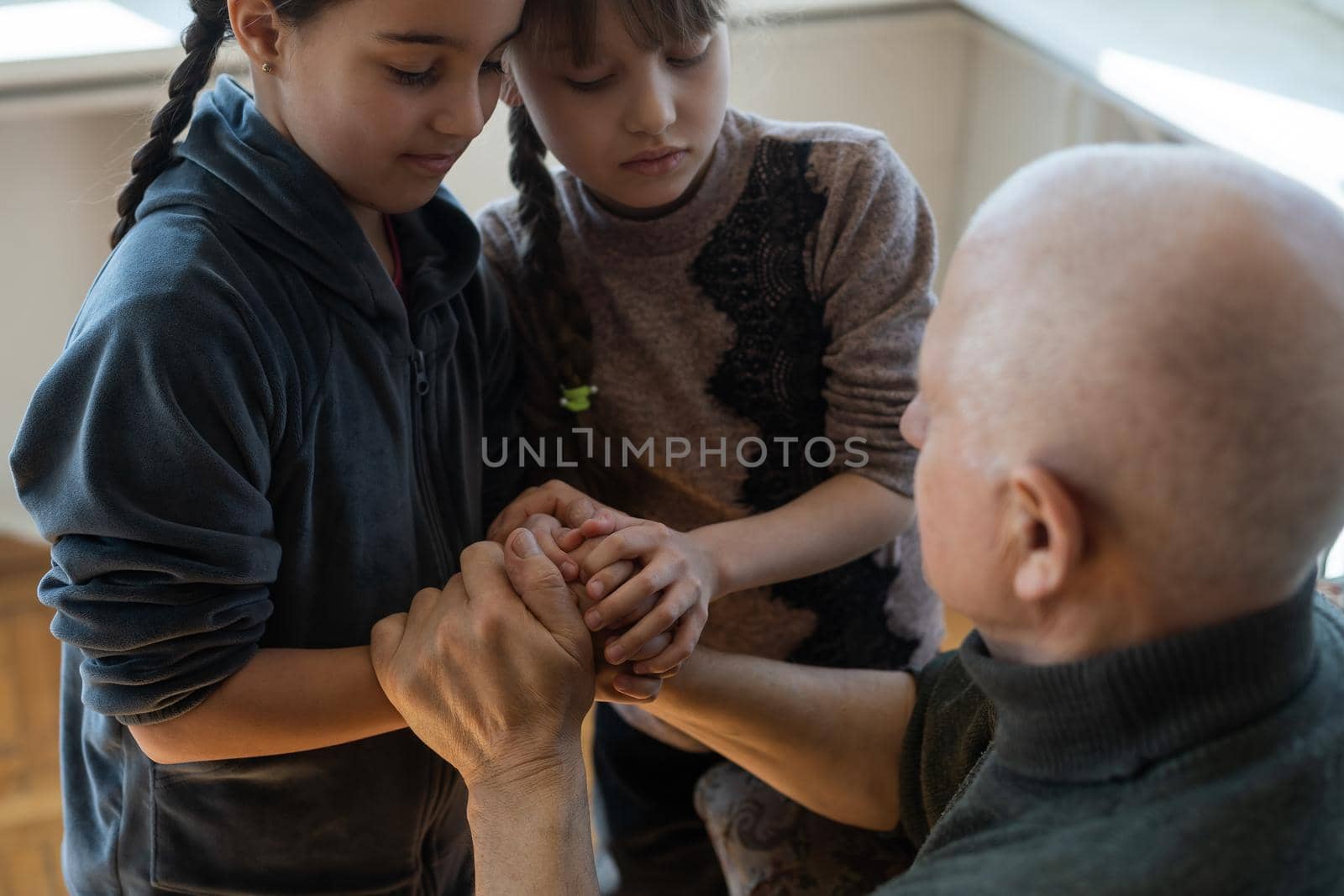 Family bonding. grandfather and child holding hands together, closeup view. Panorama.