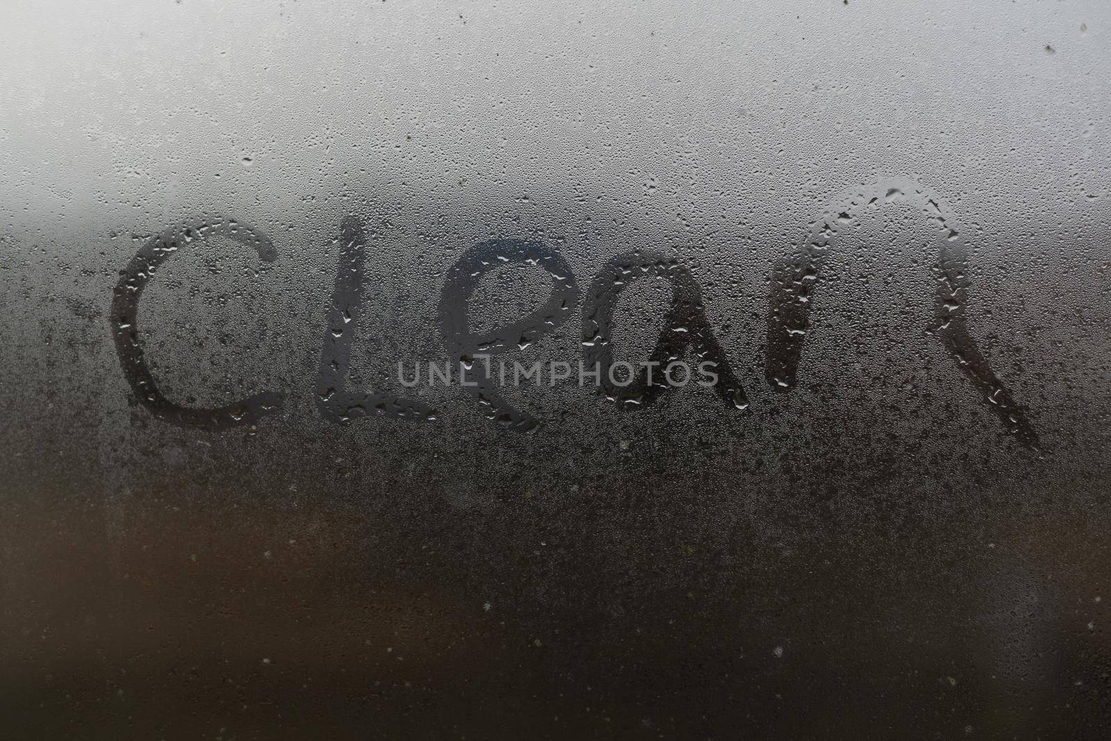 the word clean on a foggy window.