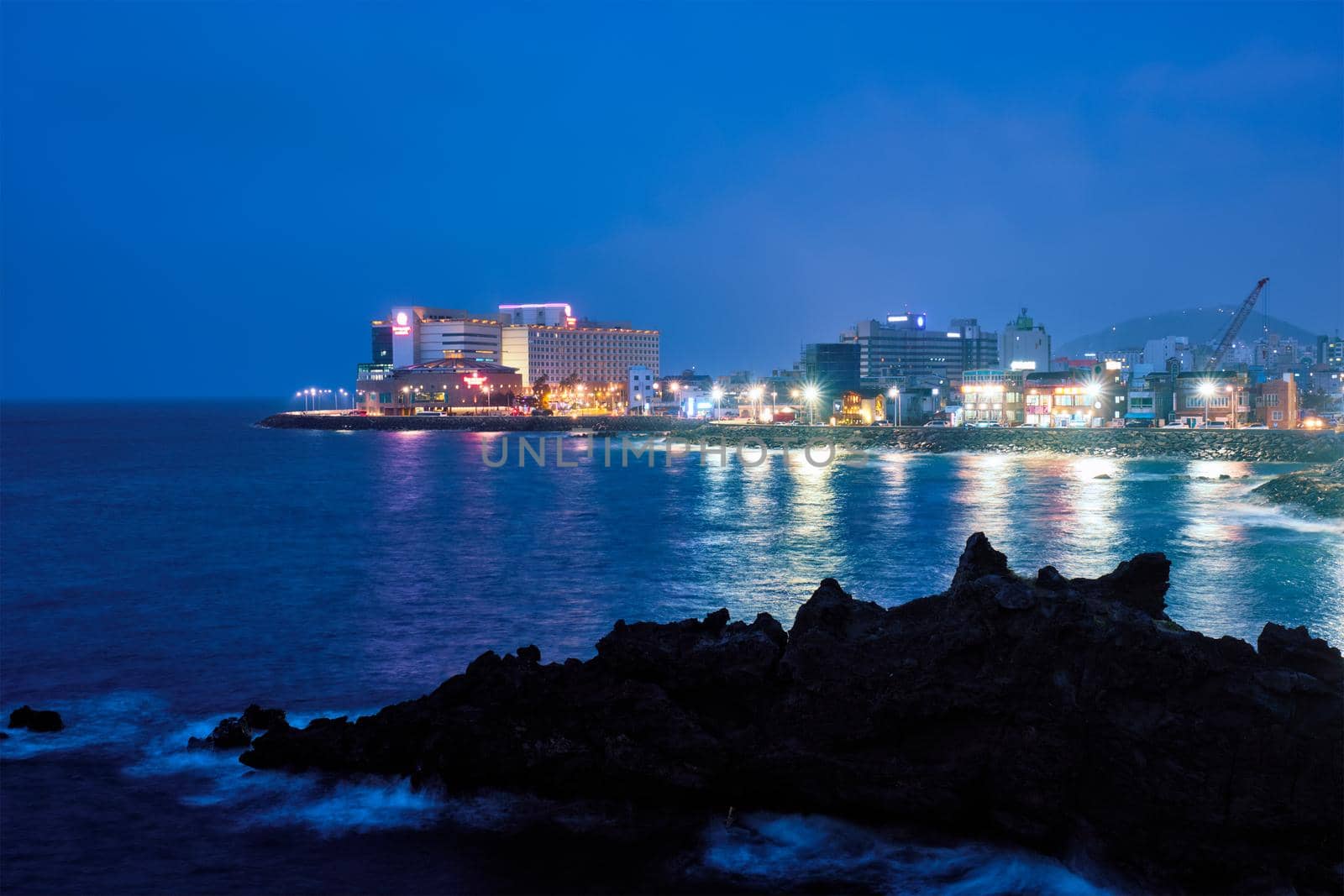 Jeju resort town illuminated in night, Jeju island, South Korea