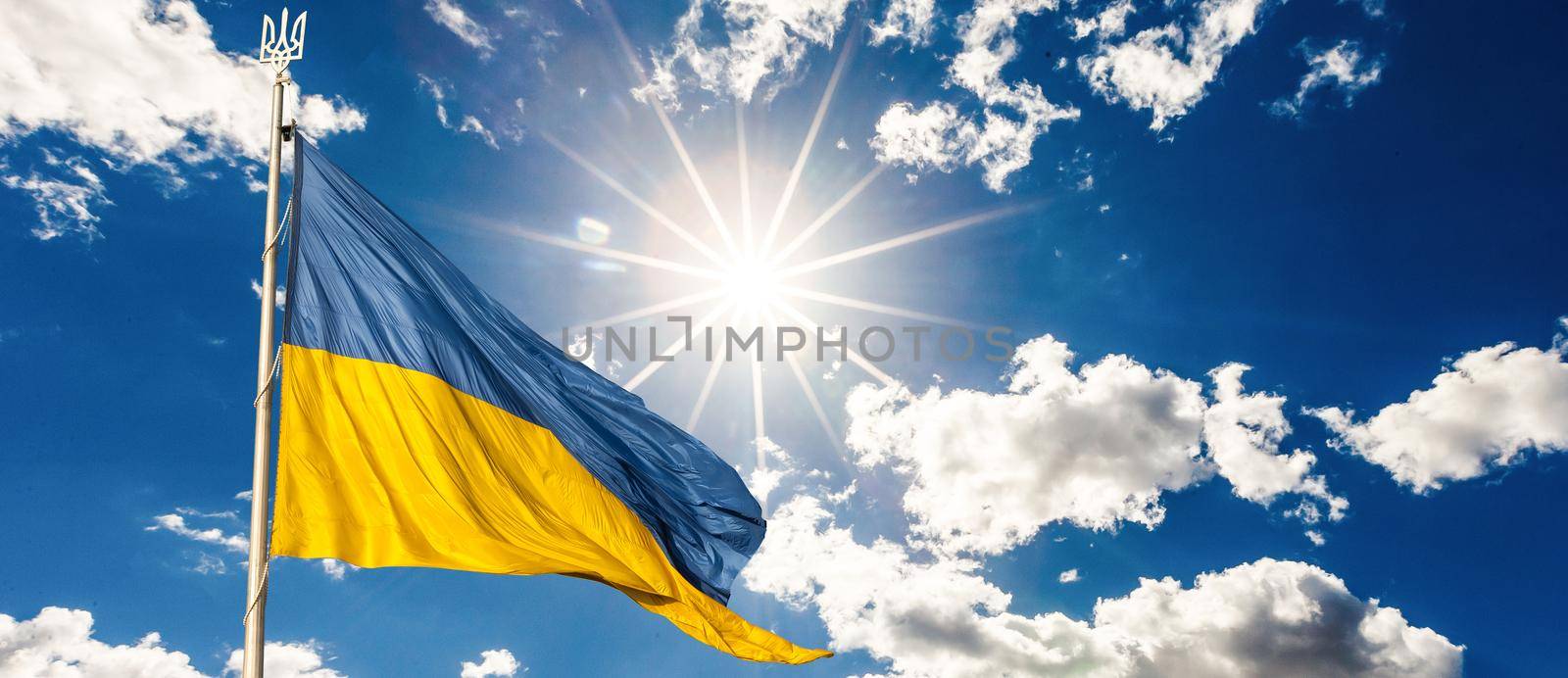 Ukrainian flag on blue sky backgroud.