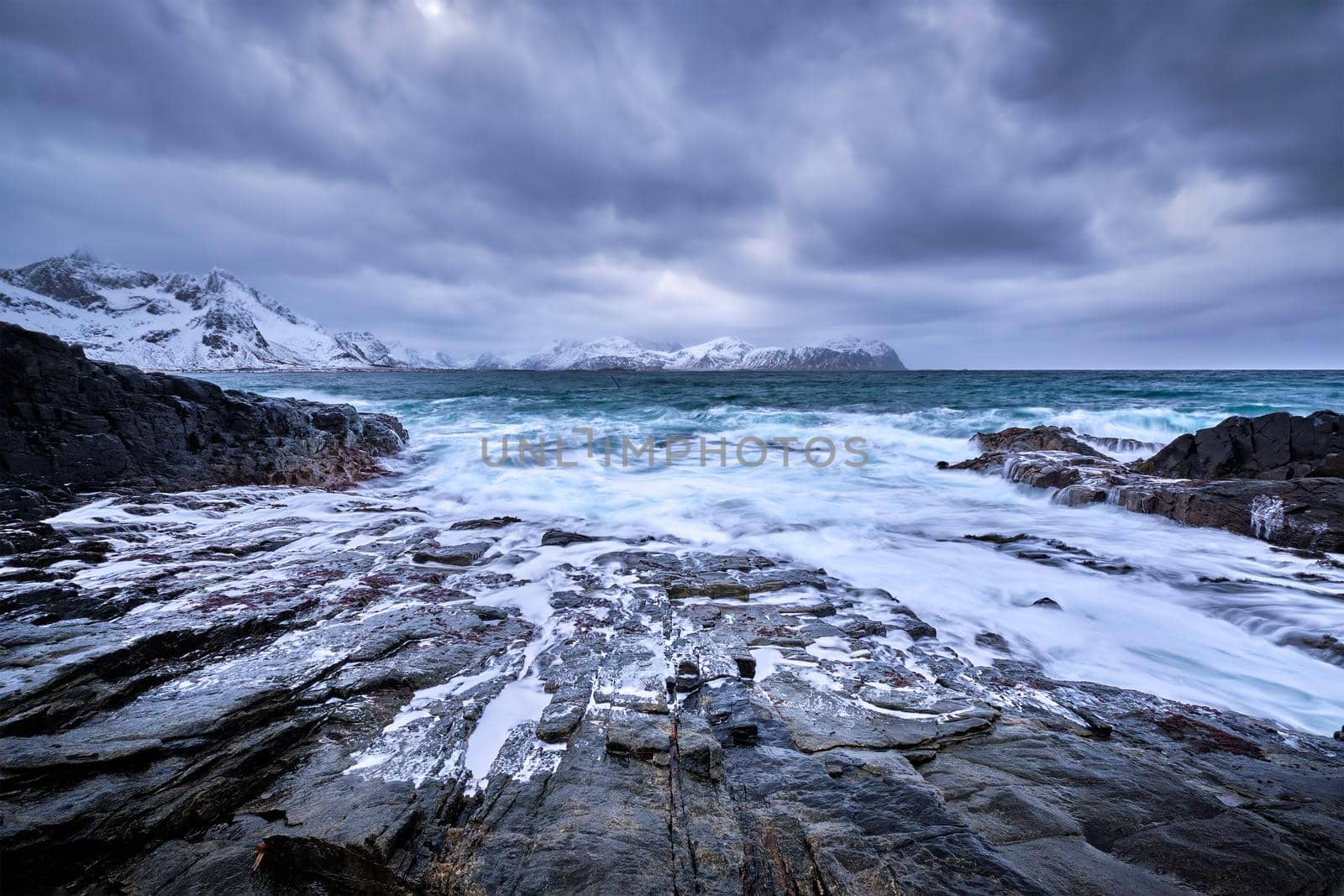 Norwegian Sea waves on rocky coast of Lofoten islands, Norway by dimol