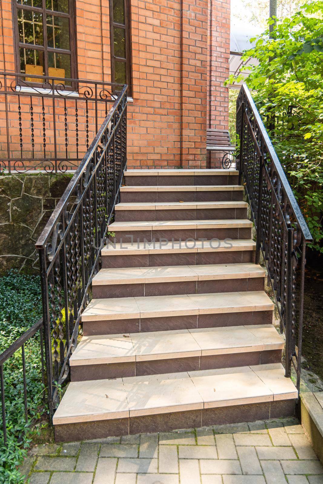 Beautiful staircase with metal railings, close-up a