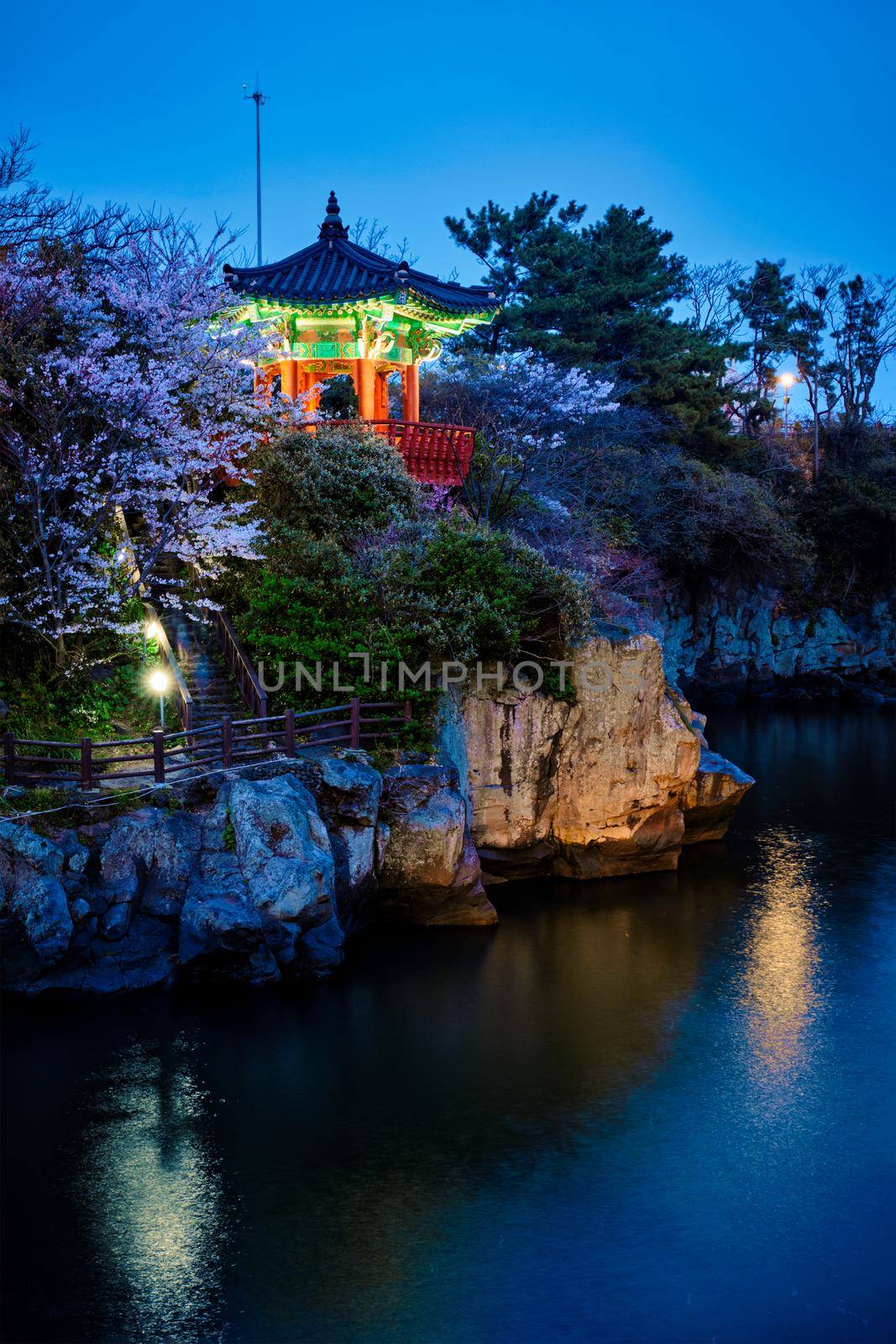 Scenic Yongyeon Pond with Yongyeon Pavilion illuminated at night, Jeju islands, South Korea