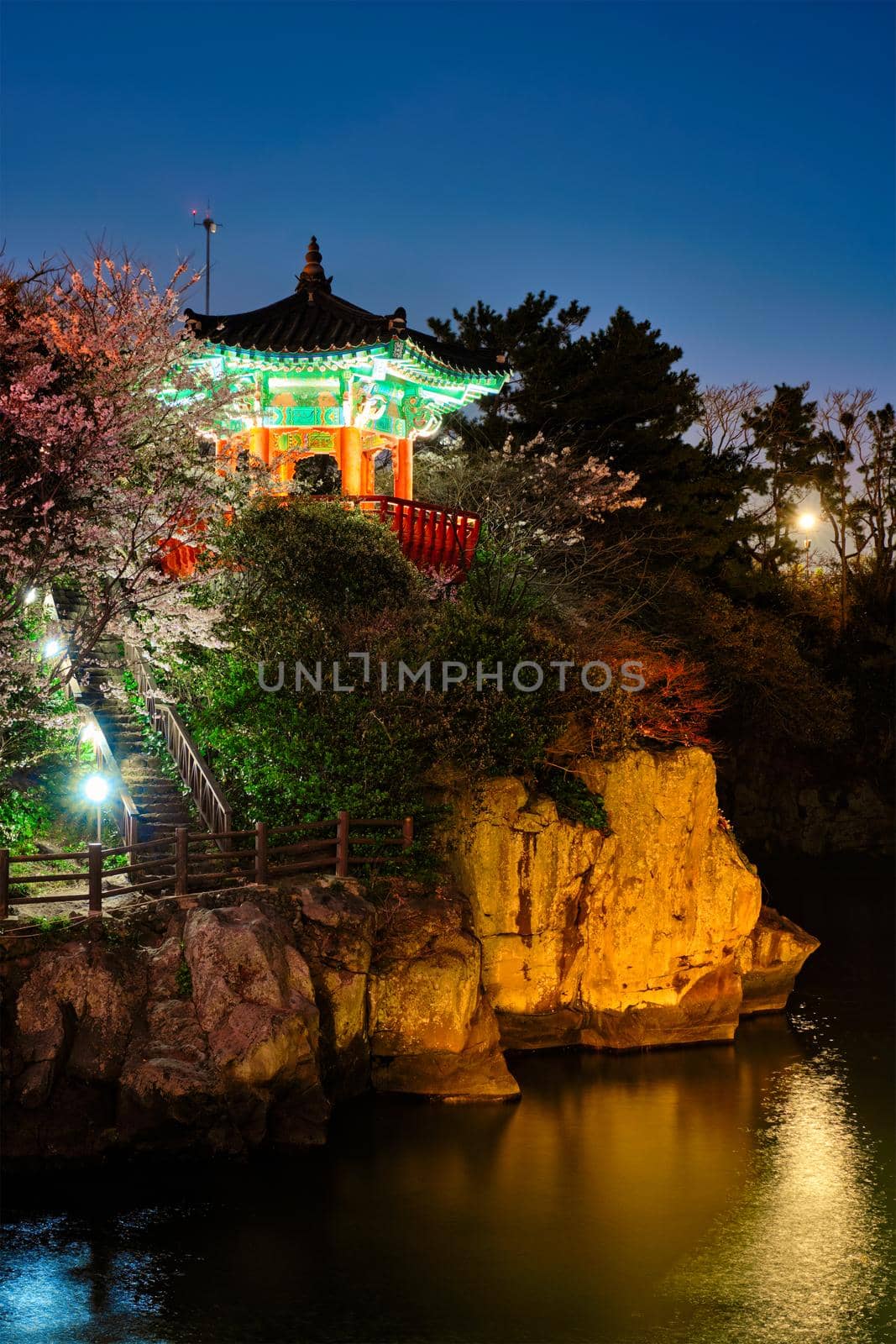 Scenic Yongyeon Pond with Yongyeon Pavilion illuminated at night, Jeju islands, South Korea