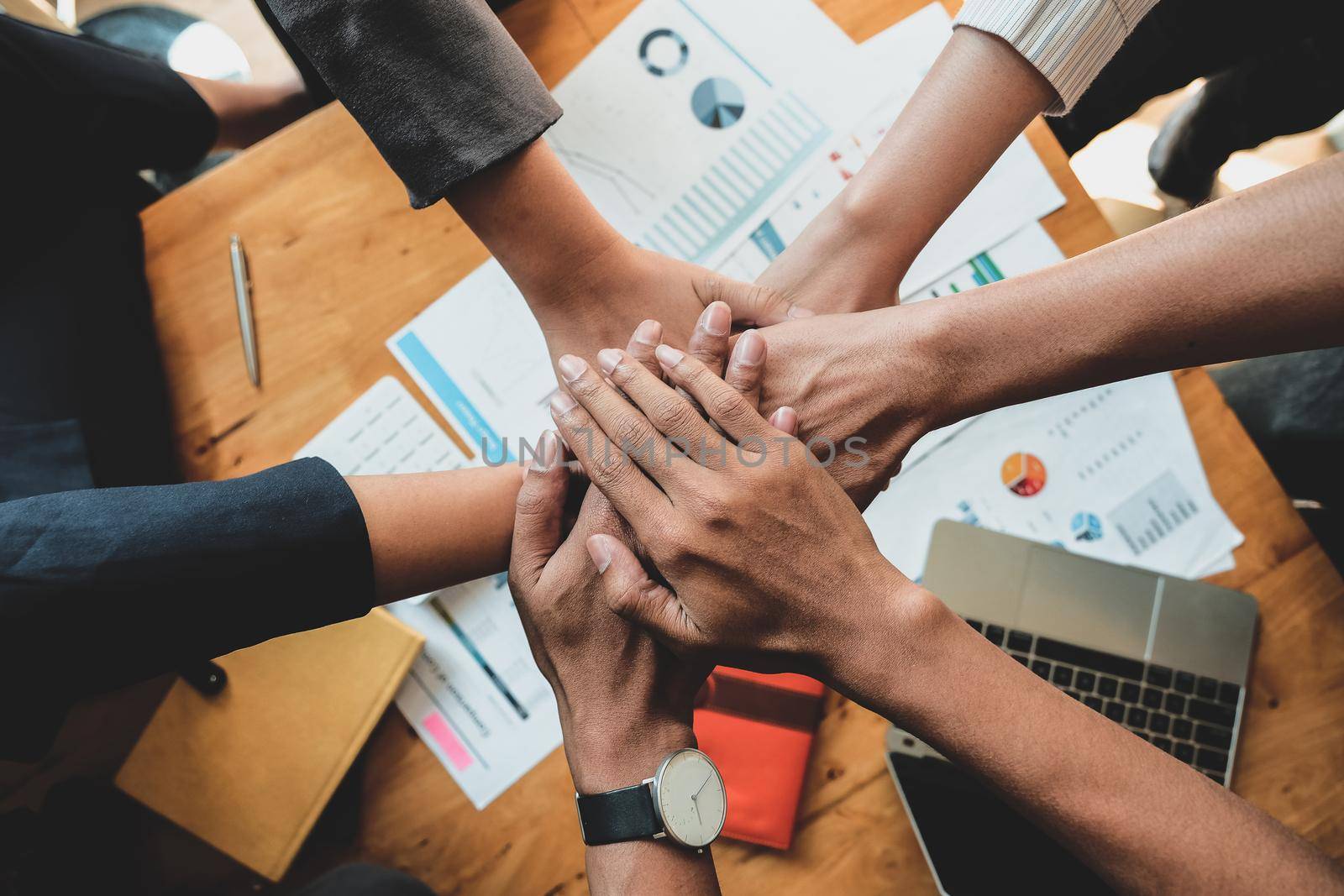 Teamwork Success. Business people group team happy showing teamwork and joining hands after meeting partner business in office. Business Concept