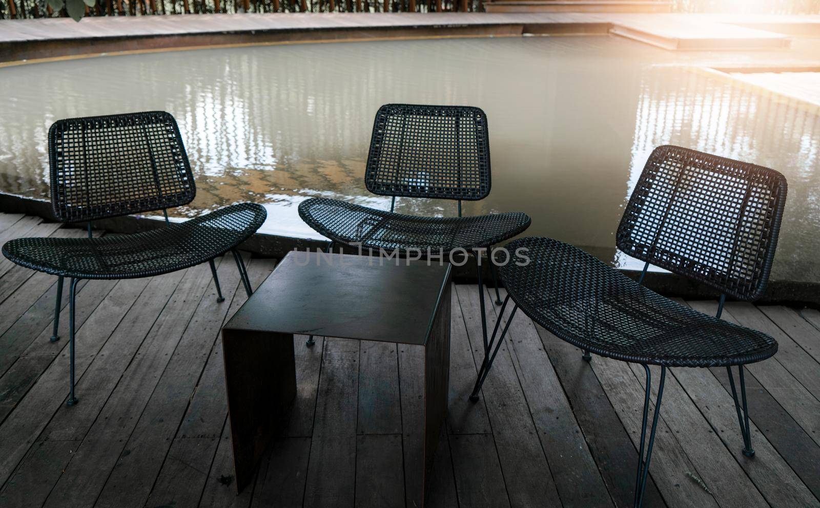 Steel table and three chairs for relaxing or meeting outside