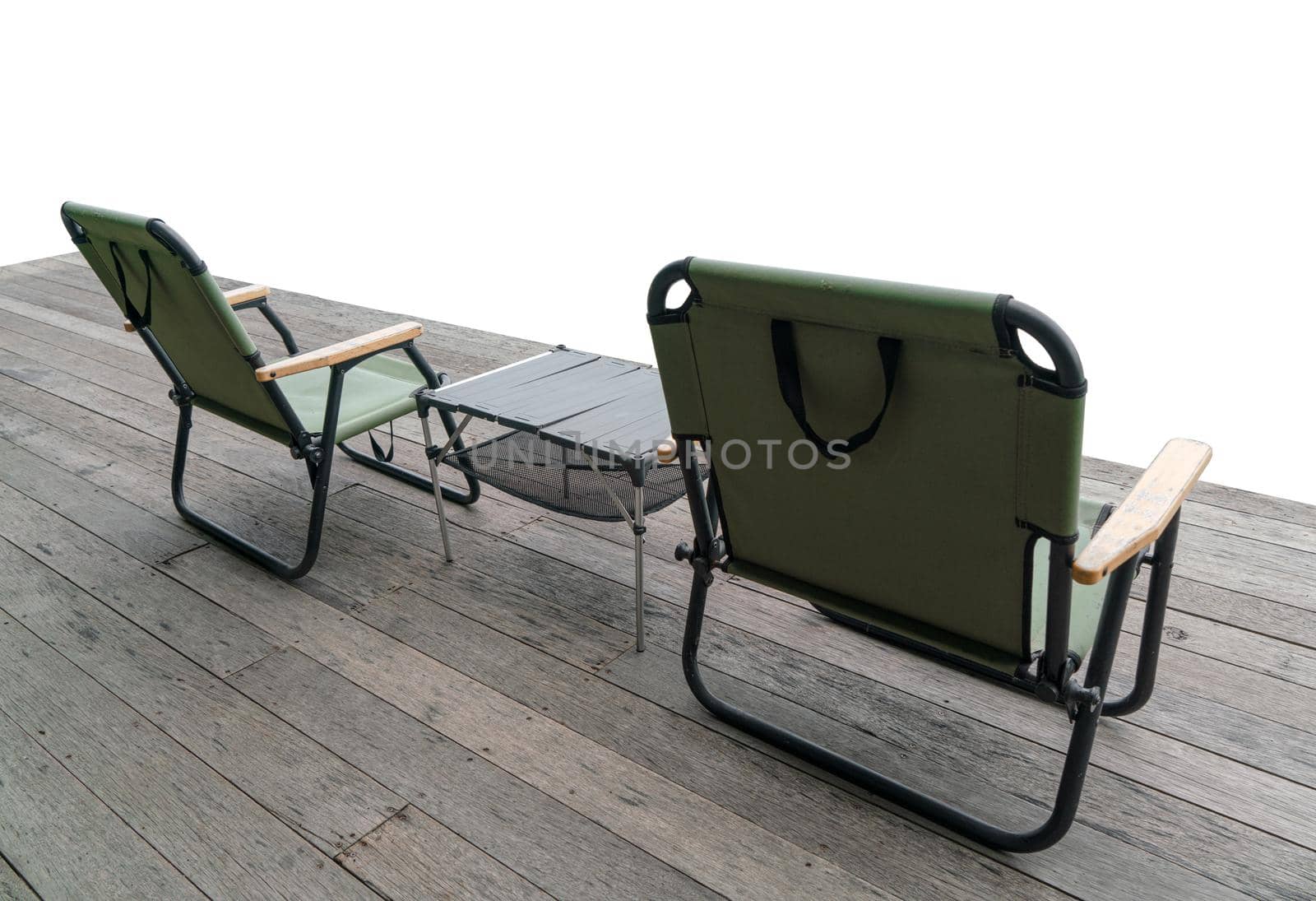 Outdoor camping seats and camping chairs and tables on isolated white.