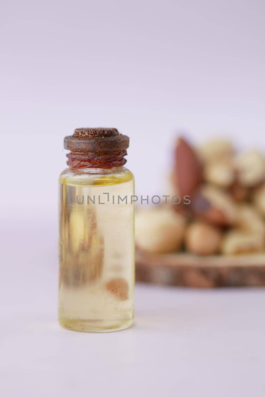 Brazilian nut and oil on table .