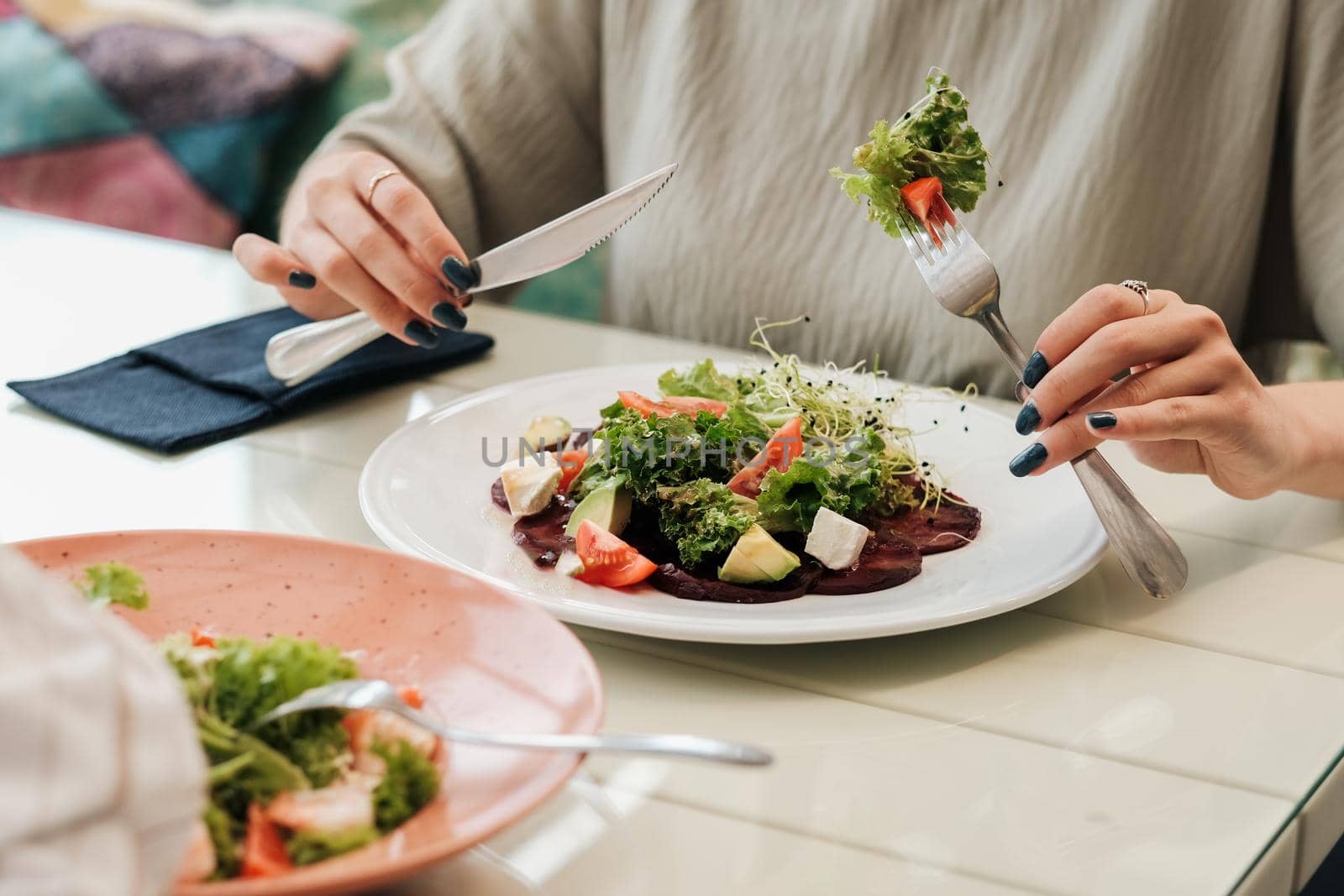 Close Up of Unrecognisable Woman Eating Salad in Restaurant