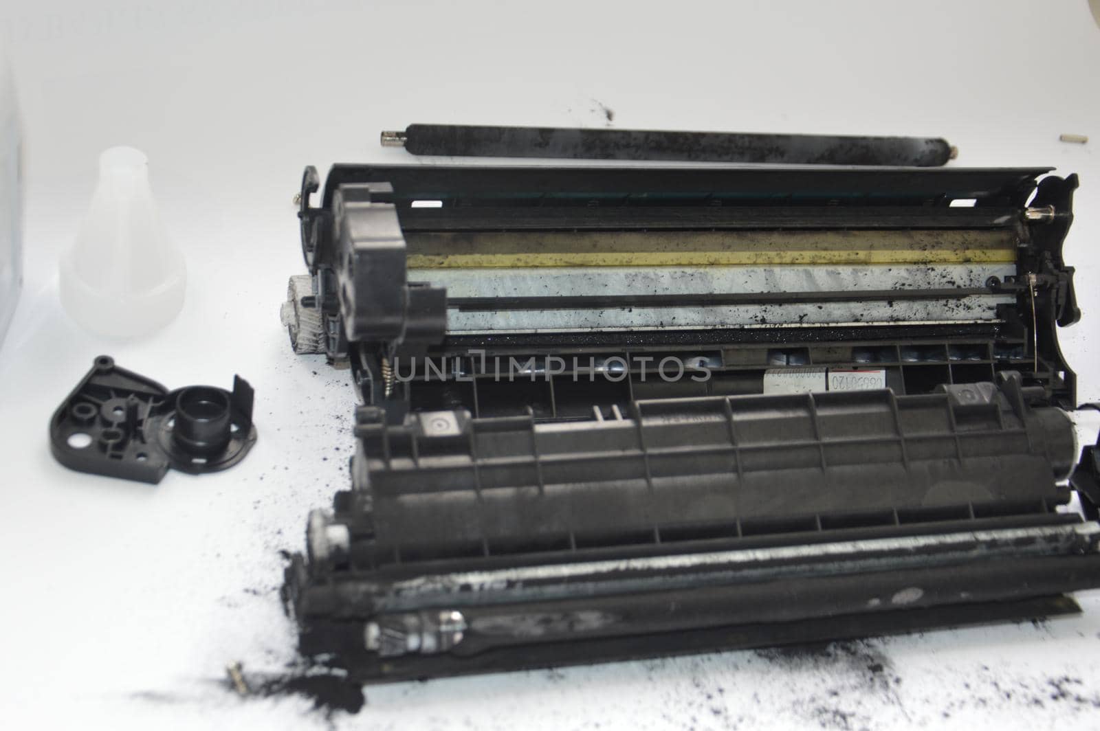 Charging the laser printer cartridge with toner the powder