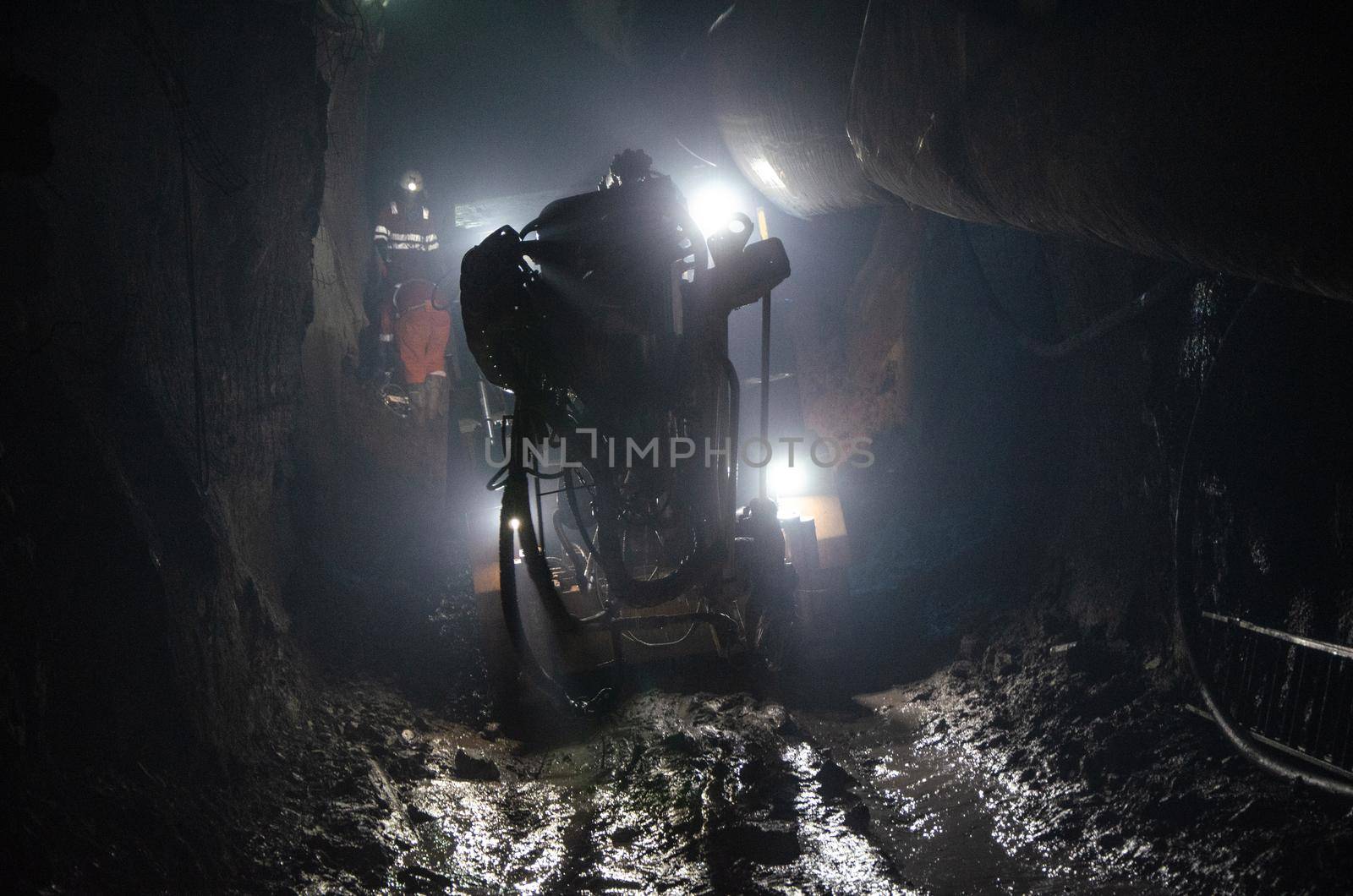 Mining operator on mining machine, underground mine mesh