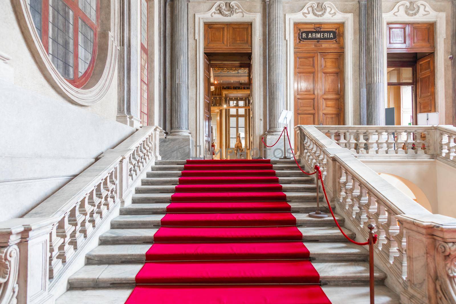 Turin, Italy - Circa January 2022: red carpet in Royal Palace - luxury elegant marble stairway.  by Perseomedusa