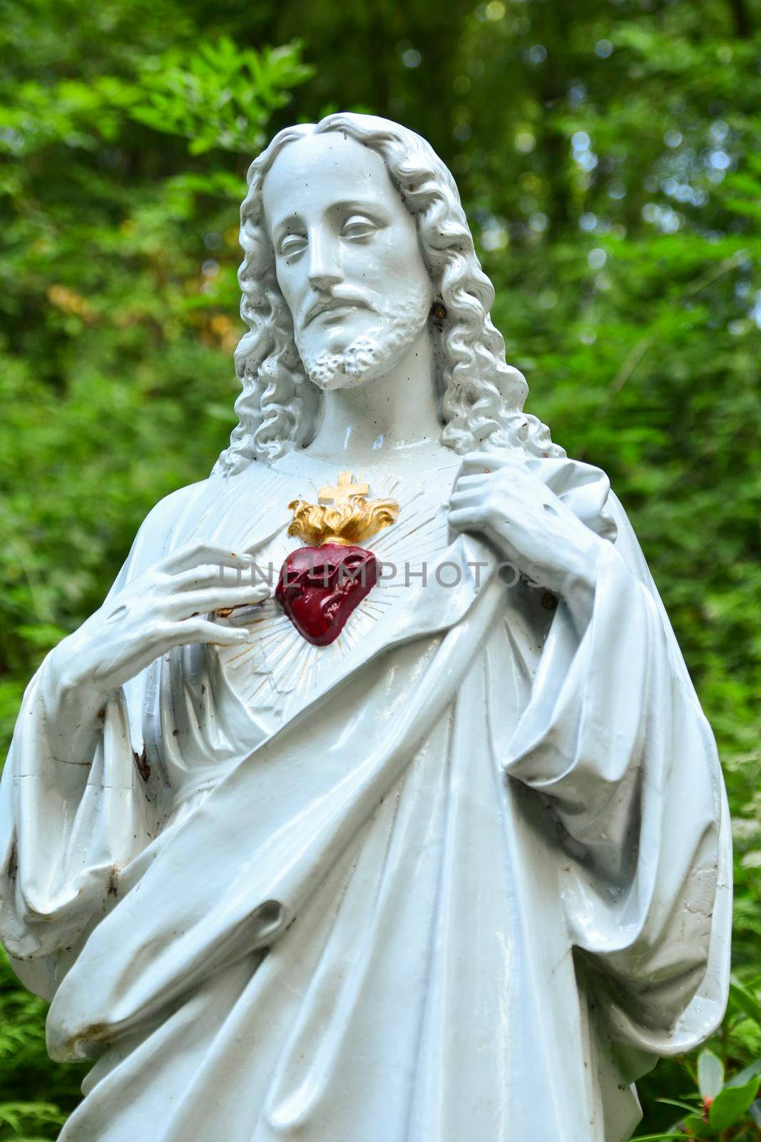 Statue of Jesus with a red heart