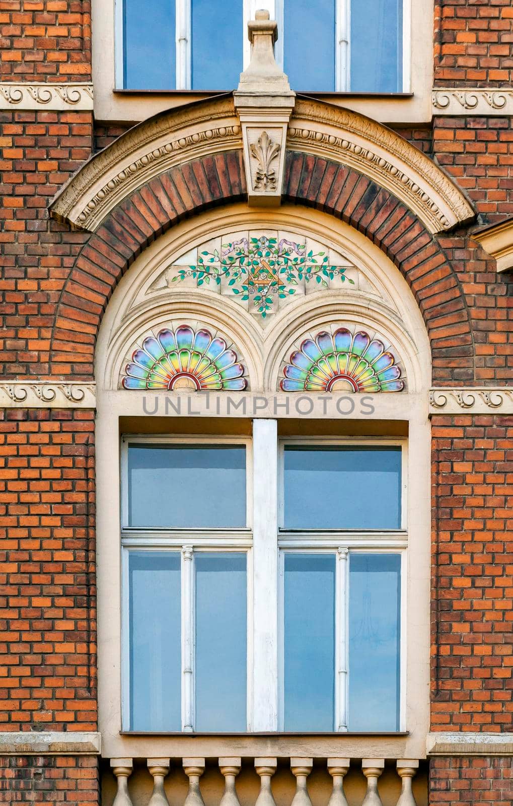 Ornate window of an old brick building