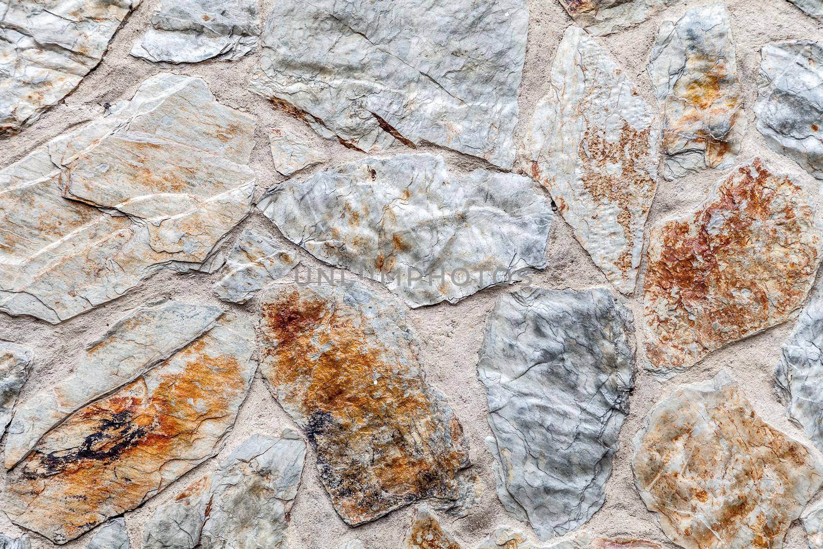 Close up of old weathered stone wall for background