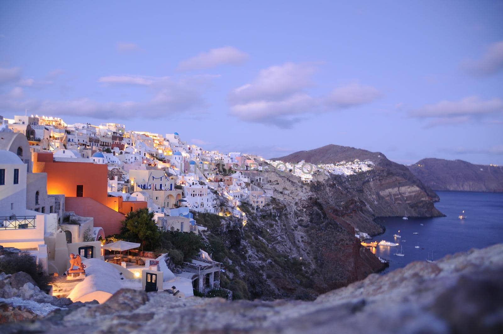 Astonishing evening view of Santorini island. Magnificent summer sunset on famous Greek resort Oia, Greece, Europe. Fantastic seascape of Mediterranena sea.