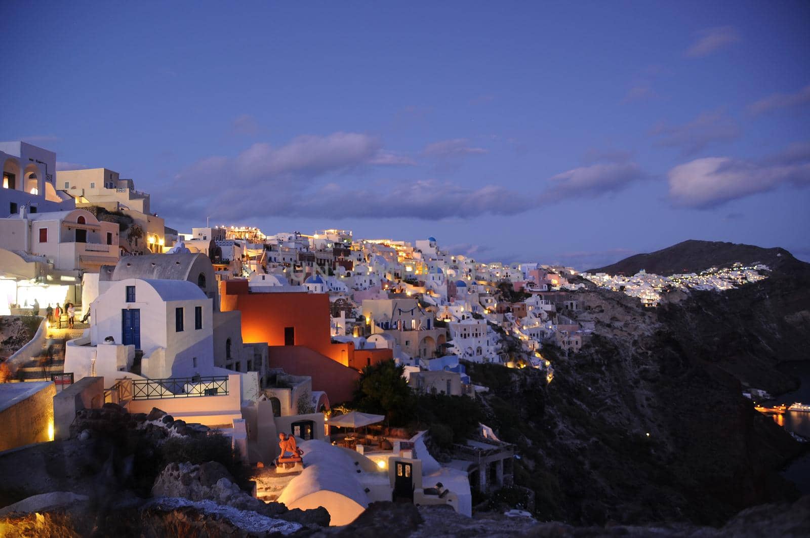 Astonishing evening view of Santorini island. Magnificent summer sunset on famous Greek resort Oia, Greece, Europe. Fantastic seascape of Mediterranena sea.