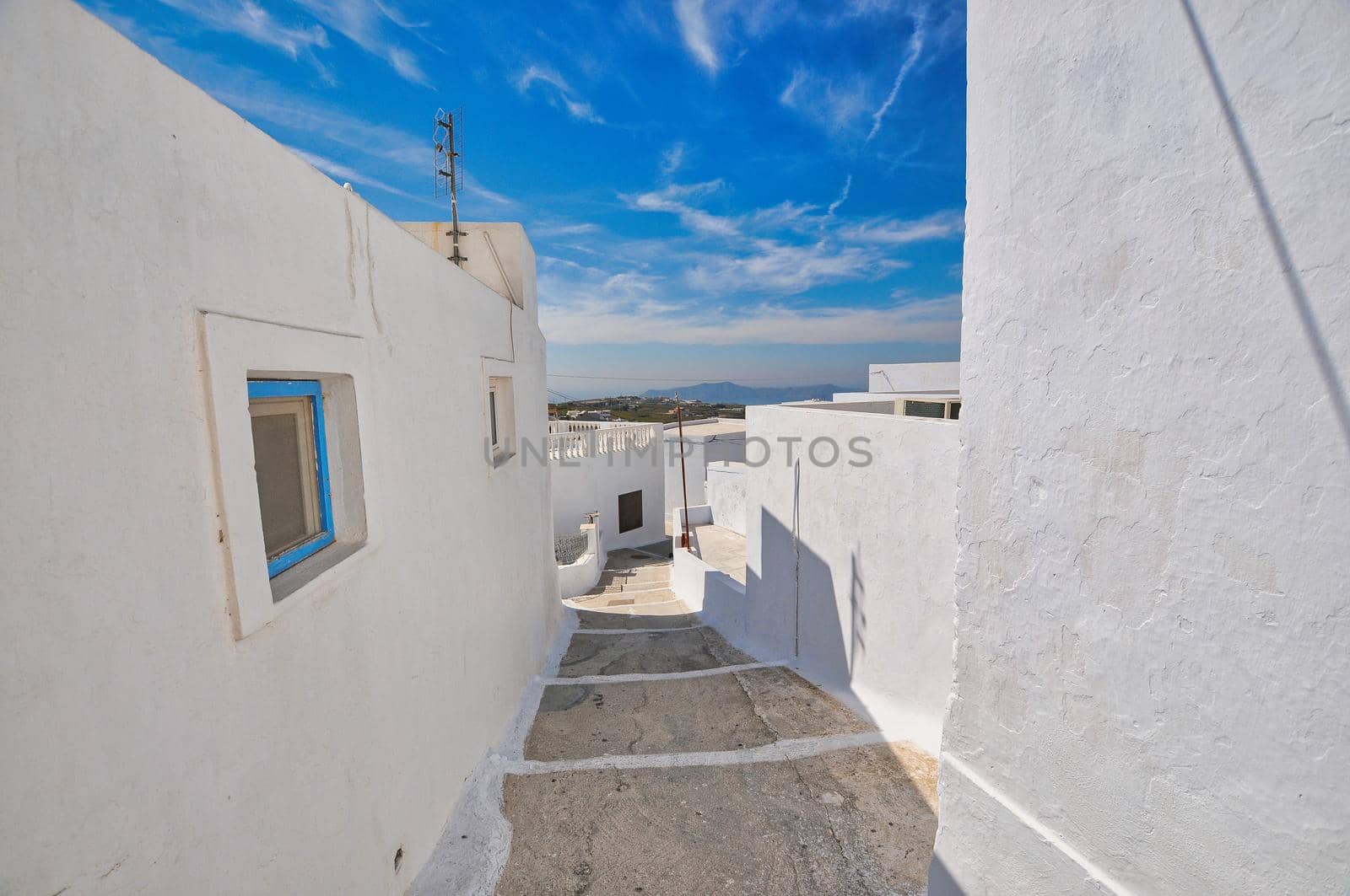 Pyrgos, Santorini, Greece. Famous attraction of white village with cobbled streets, Greek Cyclades Islands, Aegean Sea.