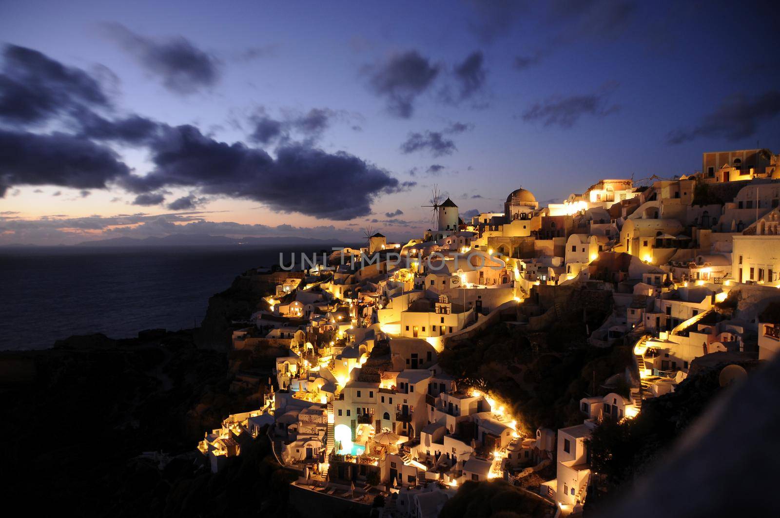 Oia in Santorini at night by feelmytravel