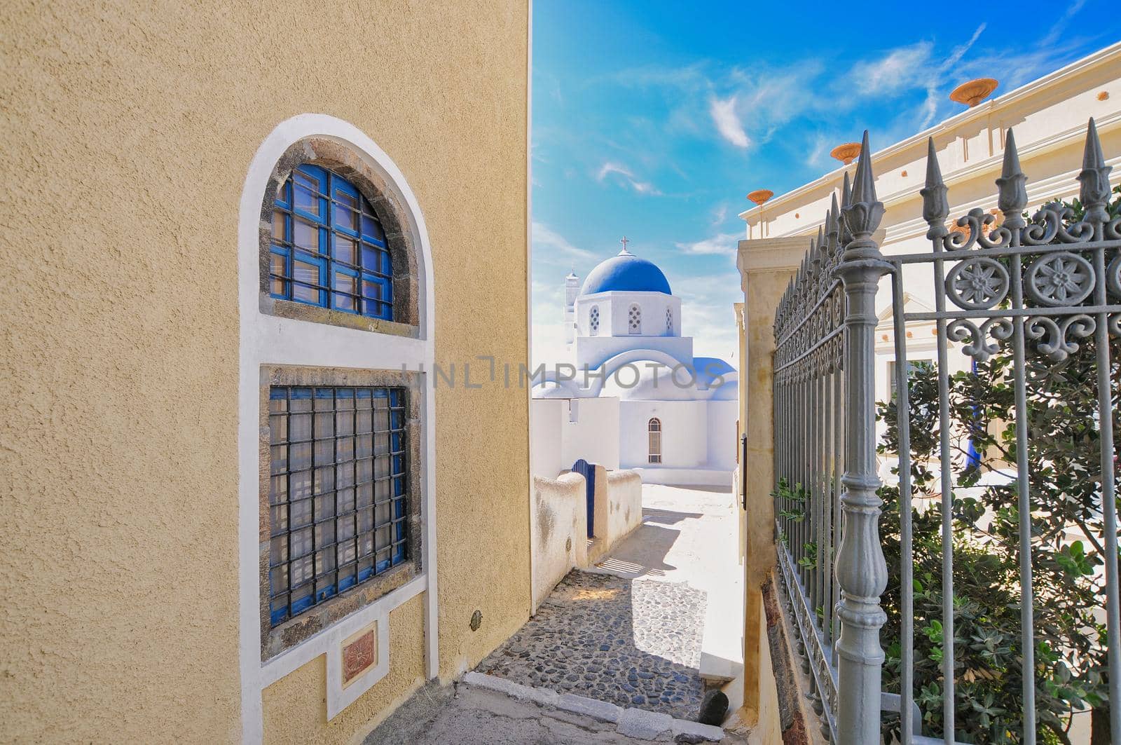 Traditional greek architecture with blue doors in the city of Pyrgos on the island of Santorini, Greece, Europe.