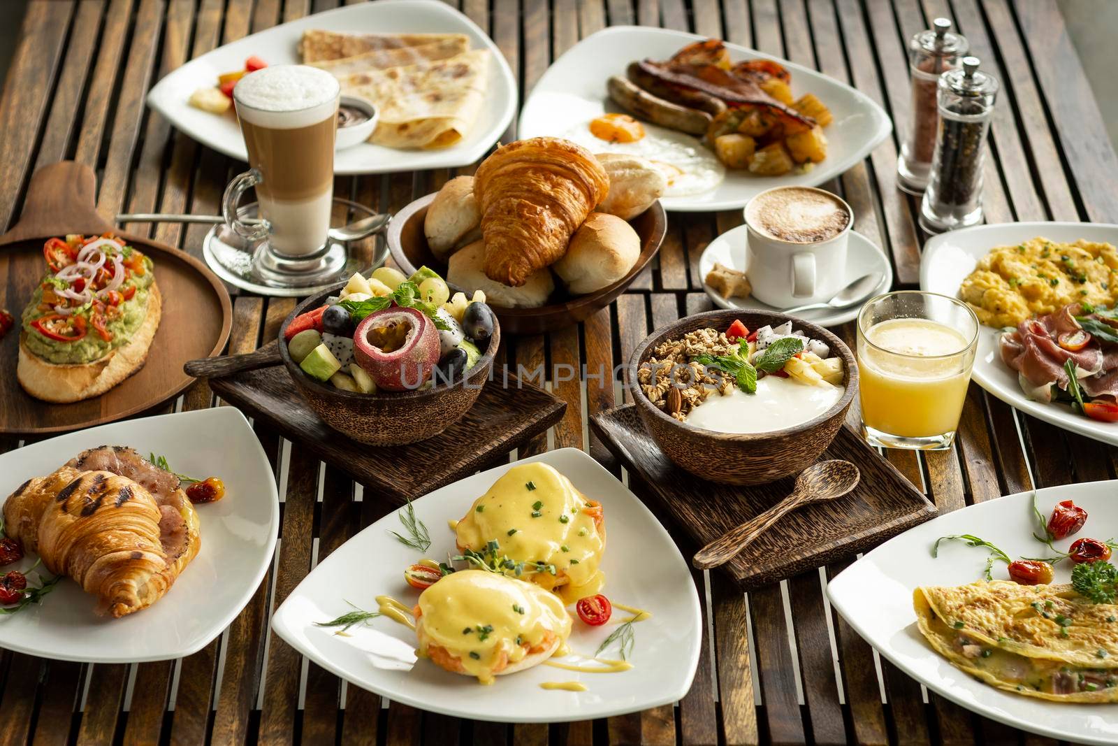 Western big gourmet breakfast selection mixed dishes on restaurant table by jackmalipan