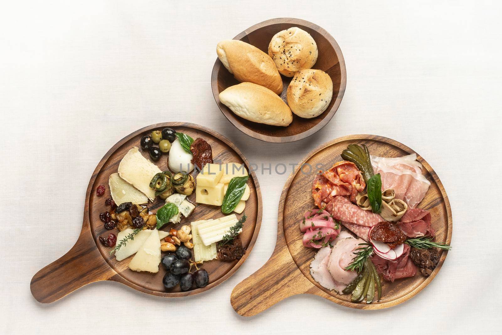antipasto gourmet charcuterie and cheese cold cuts on wood board by jackmalipan