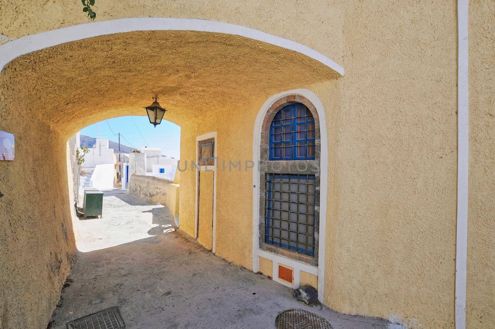 Traditional greek architecture with blue doors in the city of Pyrgos on the island of Santorini, Greece, Europe.