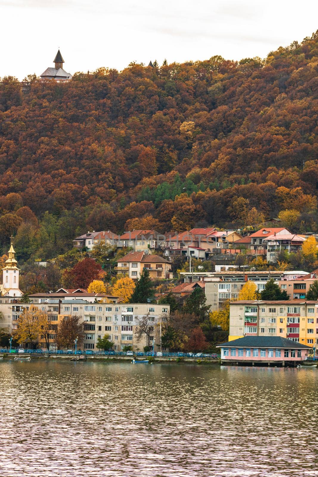 View of Danube river and Orsova city vegetation and buildings, waterfront view. Orsova, Romania, 2021