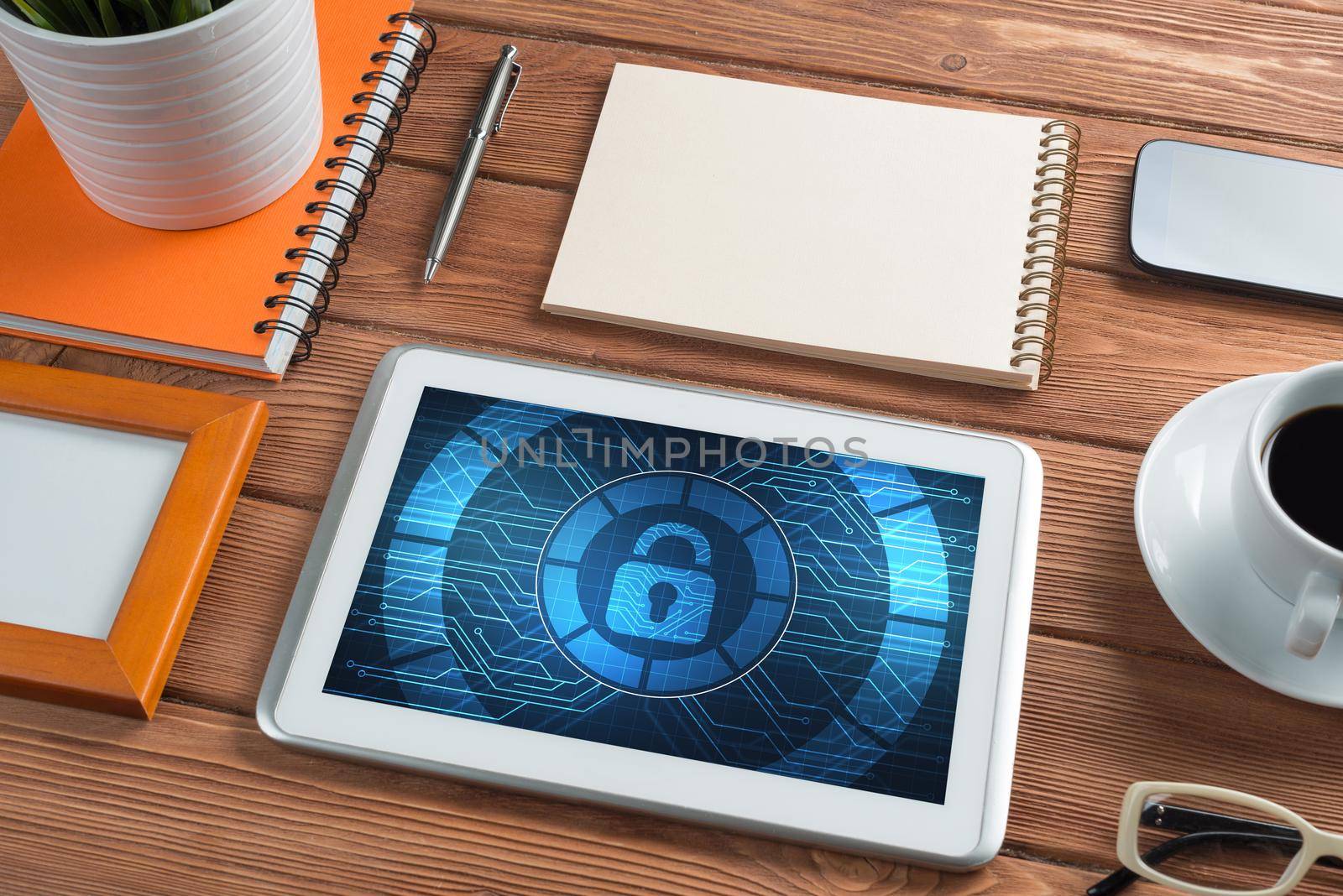 Web security and technology concept with tablet pc on wooden table by adam121