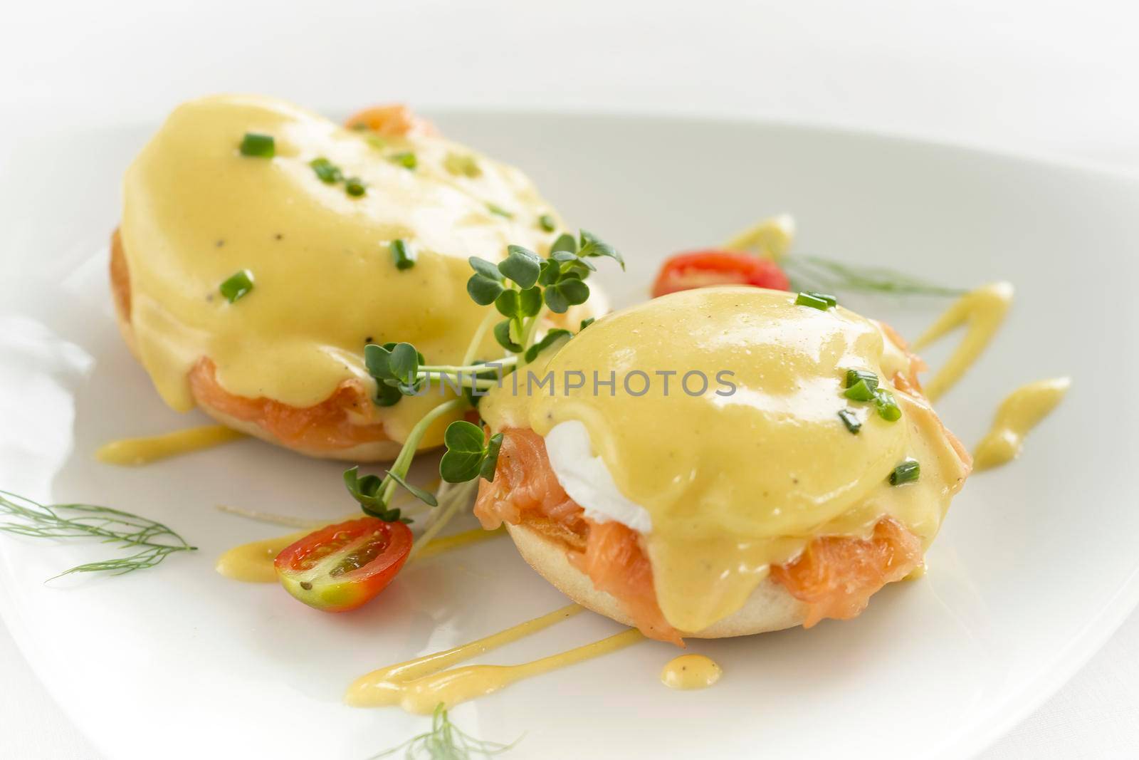 eggs benedict royale breakfast with smoked salmon and hollandaise sauce by jackmalipan