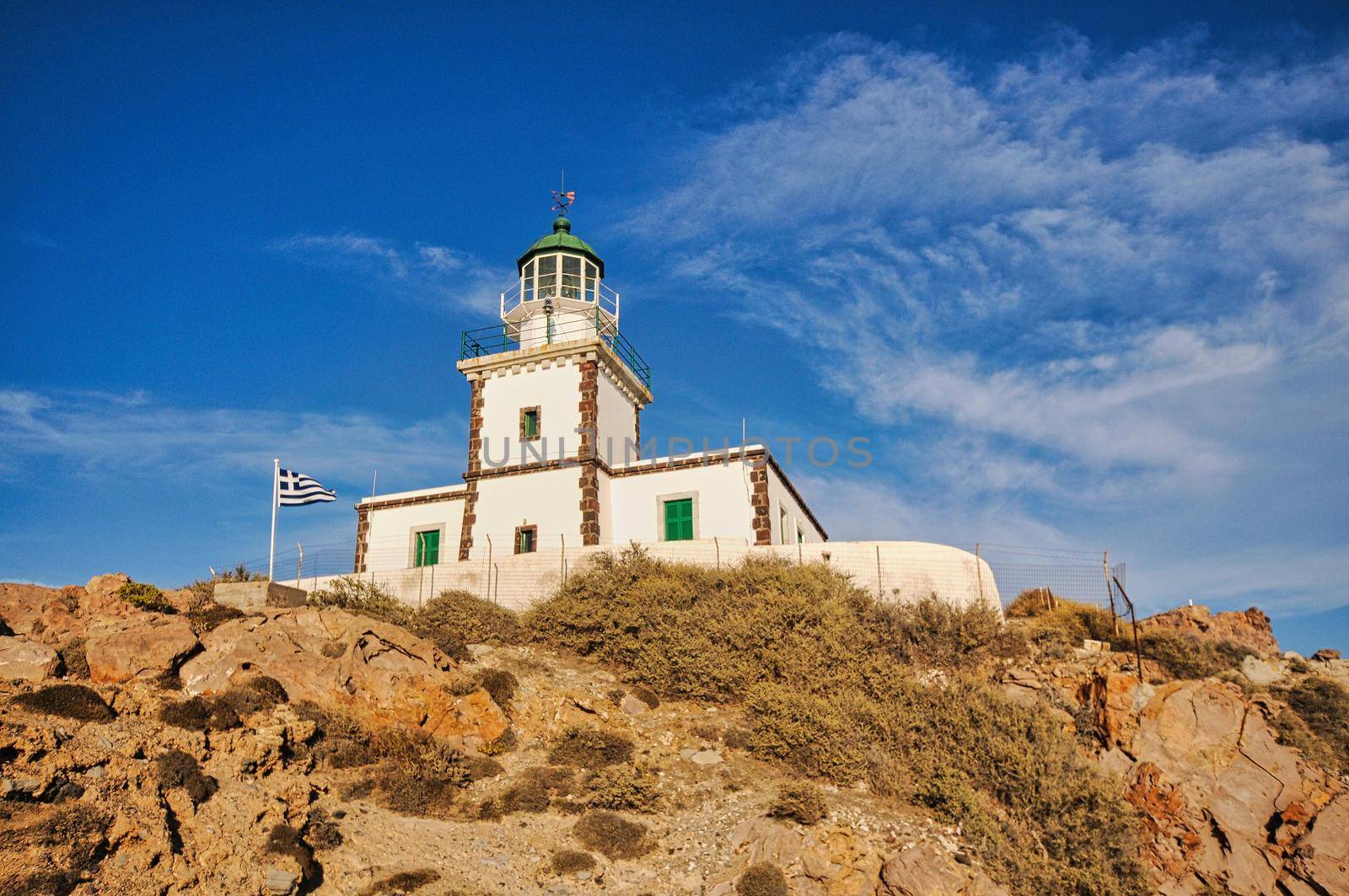 Lighthouse blue ocean at sunset landscape