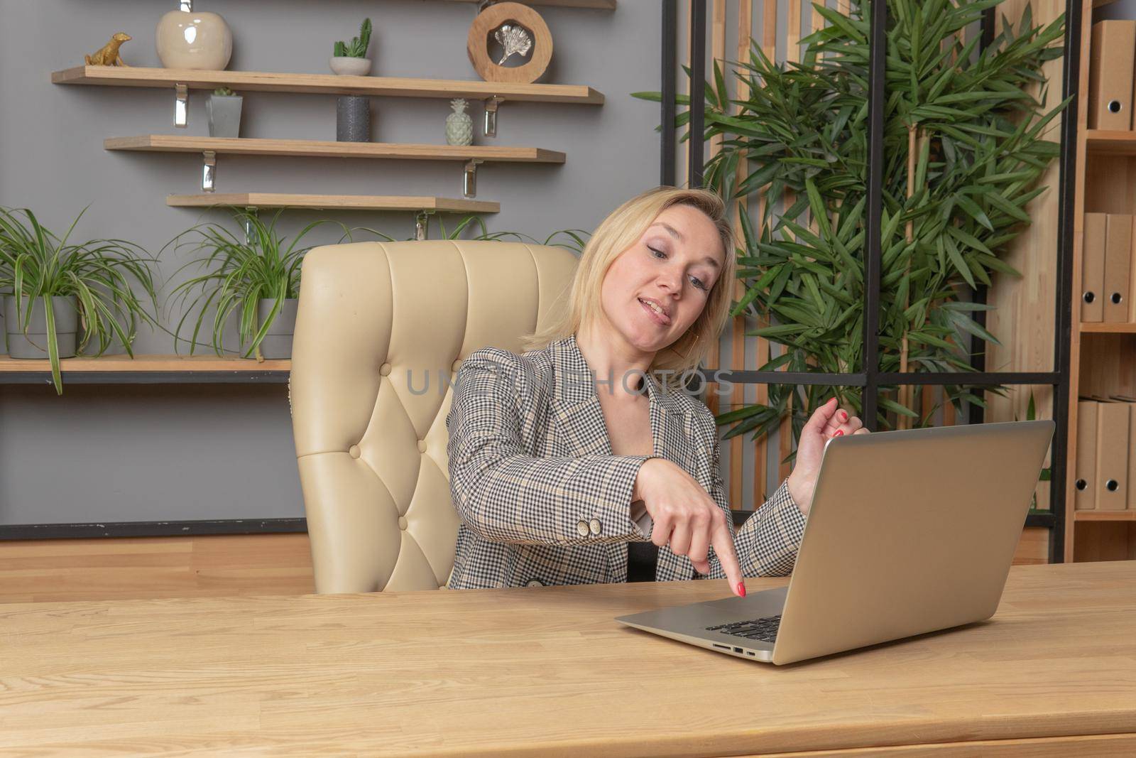 Prints on a laptop blonde in a jacket business girl laptop computer office, for indoor female in online beautiful smile, student glasses. Background fashion headphone, happy executive